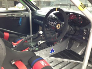 Race seats and harnesses; race sterring wheel; roll cage